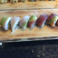 Rainbow Roll · California roll wrapped with fresh tuna, salmon, albacore, yellowtail & avo.