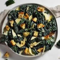 Kale Caesar Salad · Kale, parmesan cheese, and croutons with caesar dressing.