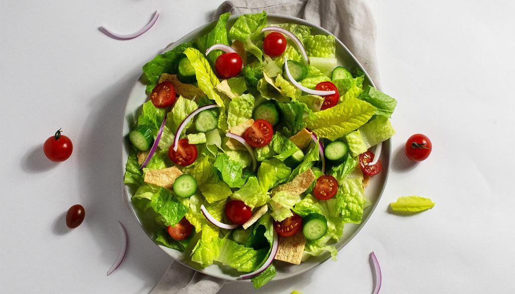 Fattoush Salad · Cucumber, tomato, onion, and pita chips, tossed with your choice of greens and dressing.