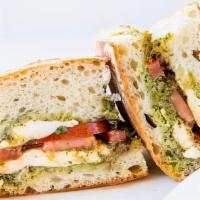 Caprese Sandwich · Our ciabatta bread. Served toasted with fresh mozzarella, ripe organic tomatoes, basil pesto...