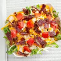 Mo Better Salad · Thousand island, grilled onions, cheddar jack cheese, tomatoes and beef bacon bits.