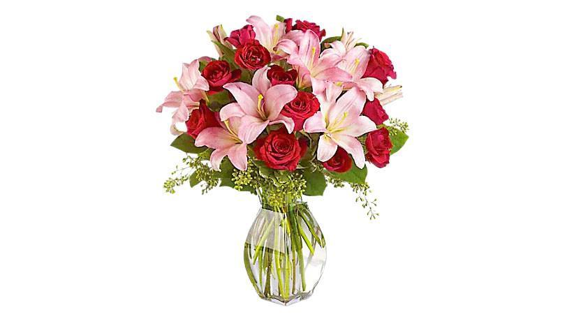 Lavish Love Bouquet With Long Stemmed Red Roses · Lovely reds and pinks come together in this lavishly romantic anniversary gift. Sweetly sentimental, this combination of colors and flowers is a delightfully fresh way to say 