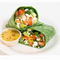 Vegetarian Healthy Wrap · Veggie wrap served with fresh lettuce, tomatoes, onions, cucumbers, bell peppers, feta chees...