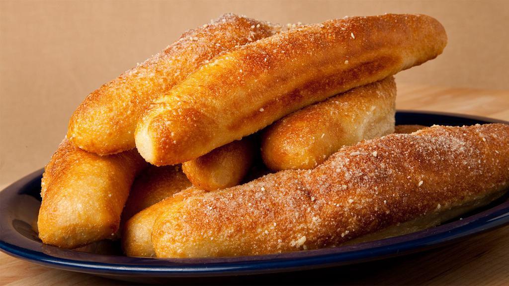 Breadsticks · Vegetarian.(6 breadsticks) golden and fluffy, coated in garlic butter, and parmesan served with ranch.