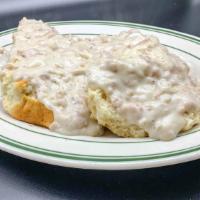 Homemade Biscuits & Gravy · Two huge country biscuits cut in half covered with our homemade country gravy.