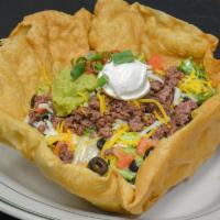 Taco Salad · Lumberjacks signature items. Crisp mixed greens tossed with our chipotle ranch dressing, top...