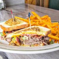 The Chain Saw · Roast beef, bacon, tomatoes, sautéed onions and mushrooms, bell pepper and cheddar cheese wi...