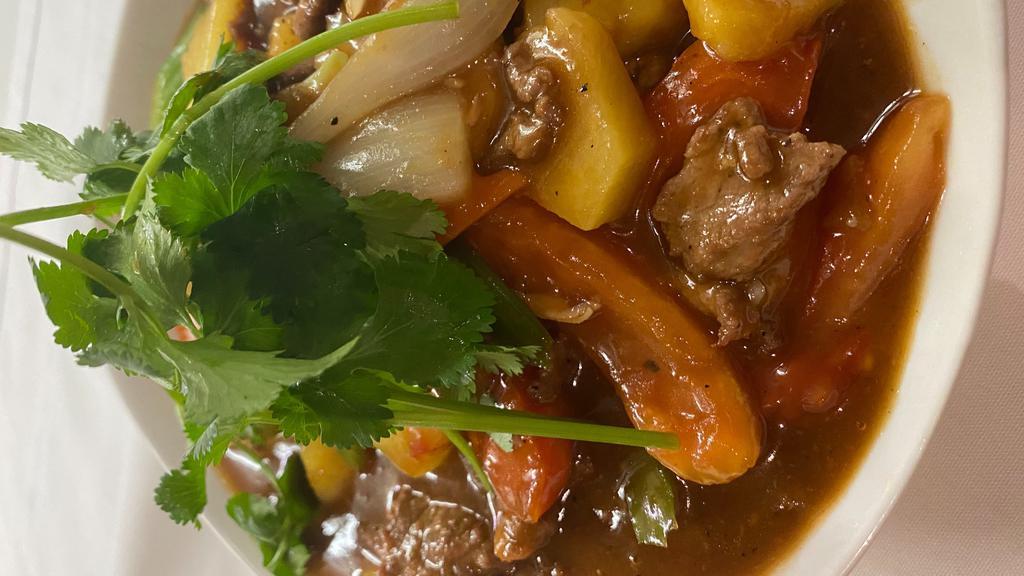 Stir-Fried Beef With Pineapple, Tomato, & Onion · Served with steamed rice.