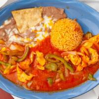 Pollo Ranchero · Chicken breast and vegetables covered with our ranchera sauce. Served with rice and beans an...