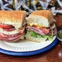 Submarine Sandwich · Romaine, tomato, onion, must, mayo, Italian dressing capocollo, mortadella, hard salami, cot...