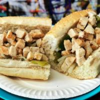 Chicken Sandwich · Chicken Breast pieces, Onions, green peppers and broth. Made on a French style roll￼.