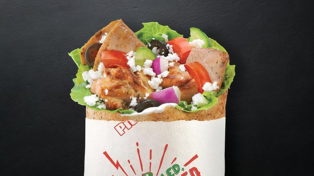 Super Greek With Schug · Gyro and Chicken Souvlaki with Spinach, Tomatoes, Cucumbers, Onions, Black Olives, Feta, Schug (zesty jalapeno parsley sauce) and Tzatziki. .