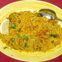 Chicken Biryani · Boneless chicken breast mixed with basmati rice cooked with onions and fresh ginger.