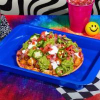 Twisted Tater Tot Nachos · Crispy tots and melted cheese topped with jalapenos, pico de gallo, sour cream, and guacamole.