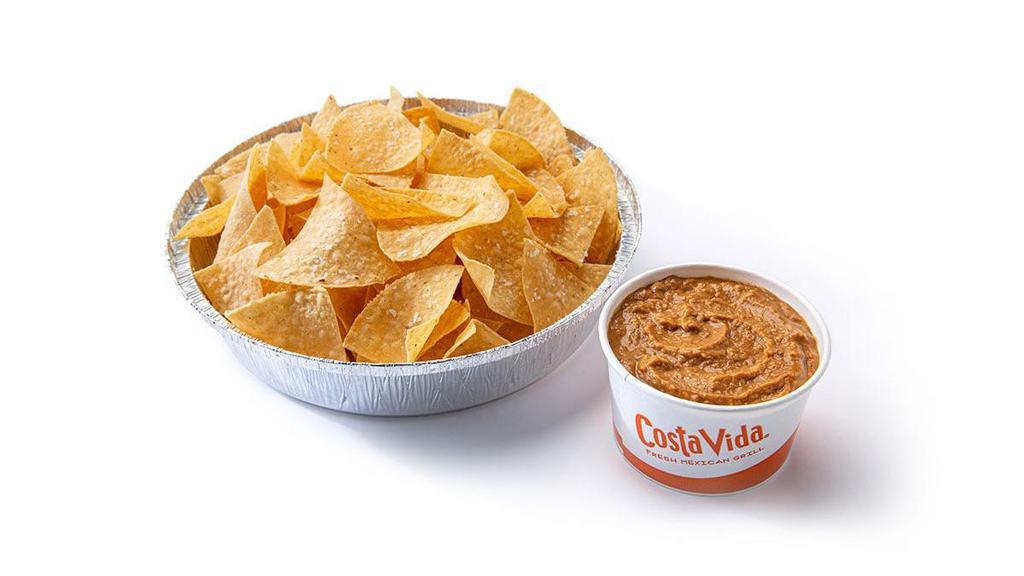 Chips & Refried Beans · House fried tortilla chips served with hot refried beans.