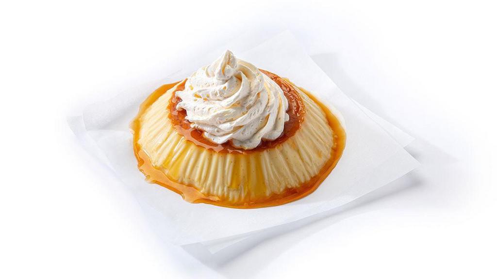 Flan · A caramelized custard dessert served with a dollop of whip cream on top.