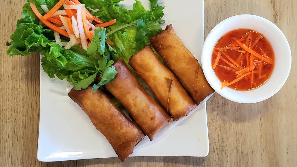 Egg Rolls · 4 Egg rolls filled with mixed ground pork, taro, carrots, onions, and mushrooms. Served with a blend.