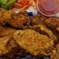 Fried Chicken Wings · 6 pieces of marinated fried chicken wings.