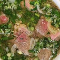Special Pho · Steak, tendons, fat brisket, flank tripe, and meatballs in a clear beef broth.