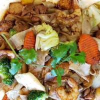 Chow Fun · It comes with thick rice noodles with seasonal vegetables in a light gravy sauce.