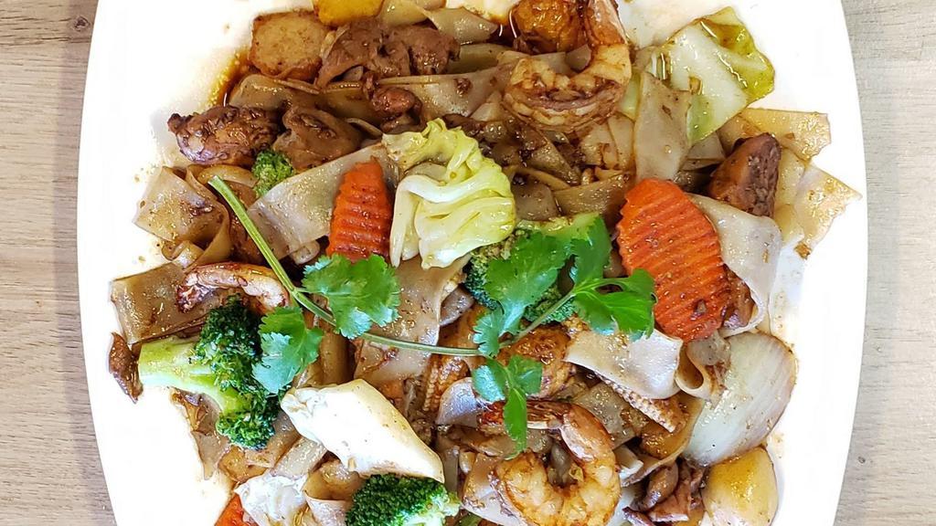 Chow Fun · It comes with thick rice noodles with seasonal vegetables in a light gravy sauce.