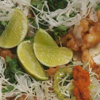 Shrimp Taco · Top with cabbage, onion, and cilantro.