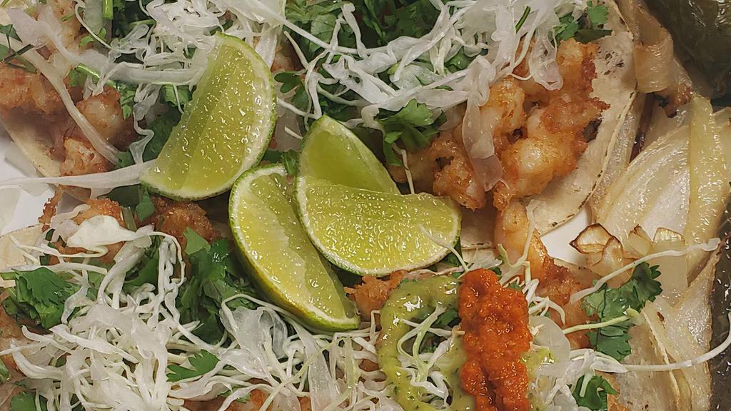 Shrimp Taco · Top with cabbage, onion, and cilantro.