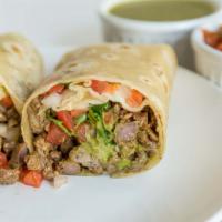 Carne Asada Burrito · Guacamole and pico de gallo note: make it wet options removes guacamole and pico de gallo an...