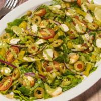 Greek Salad · Olives, pepperoncini, tomato, red onion, mozzarella, pesto, aged balsam.