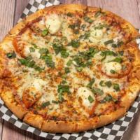 Pizza Margherita · Tomato, basil, mozzarella.