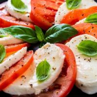 Caprese Salad · Fresh sliced Mozzarella, Tomatoes, Basil, Olive Oil, Balsamic Reduction