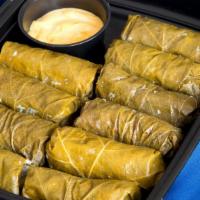 Dolmathes With Lemon Sauce (Heat & Serve) · Grape leaves stuffed with beef and rice (10 pack). Heat and Serve