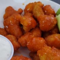 New! Buffalo Cauliflower · Battered Cauliflower tossed in buffalo sauce, served with carrots and celery and ranch.