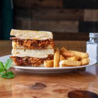 Ultimate Chicken Sandwich · Grilled chicken breast, BBQ, pulled pork, bacon, and American-Swiss cheese served on sourdou...