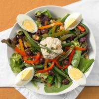 La Salade Nicoise · Romaine, tomatoes, green beens, red bell peppers, olives, hard boiled egg, tuna, mustard vin...