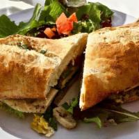 Chicken Pesto · In a French Baguette: Chicken, gruyere, house pesto, onion, tomatoes,  and greens.