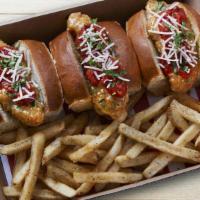 Italian Bird Dogs · 3 Chicken fingers tossed in Garlic Parmesan sauce on mini buns with marinara and Parmesan-Ro...