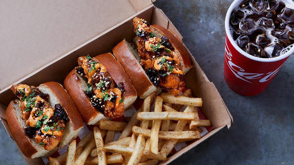 Whiskey-Glazed Bird Dogs · 3 Chicken fingers tossed in Whiskey-Glaze on mini buns with spicy aioli and sesame seasoning. Paired with seasoned fries.