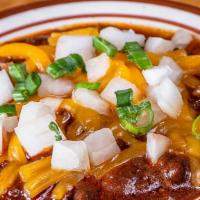 Chili Bowl · All beef chili topped with shredded cheddar cheese, raw & green onions, served with your cho...