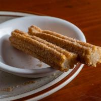 Churro · A classic fried pastry, rolled in cinnamon and sugar.
