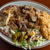Carnitas De Puerco · A traditional Mexican favorite.  Tender lean pork that’s slowly roasted and marinated with o...