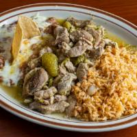 Chile Verde · Sliced pork simmered in a blend of spices, and mild green chili peppers. Served with rice, a...
