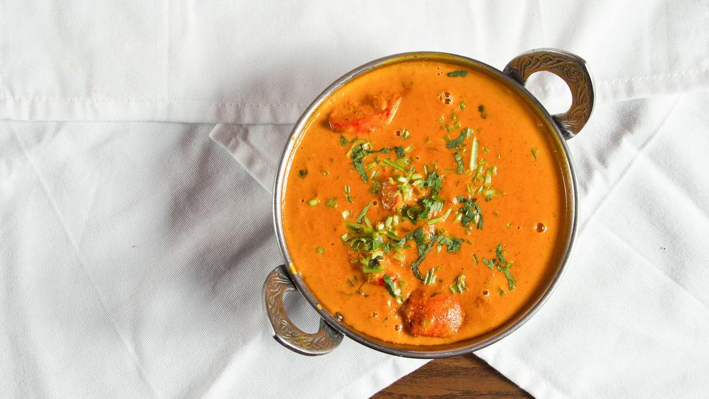 Chicken Tikka Masala · India oven specialty. Boneless piece of chicken tikka cooked in creamy butter sauce with fresh tomatoes and fragrant spices.