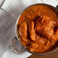 Chicken Curry · Skinless and boneless chicken cooked in a mildly spiced curry sauce.