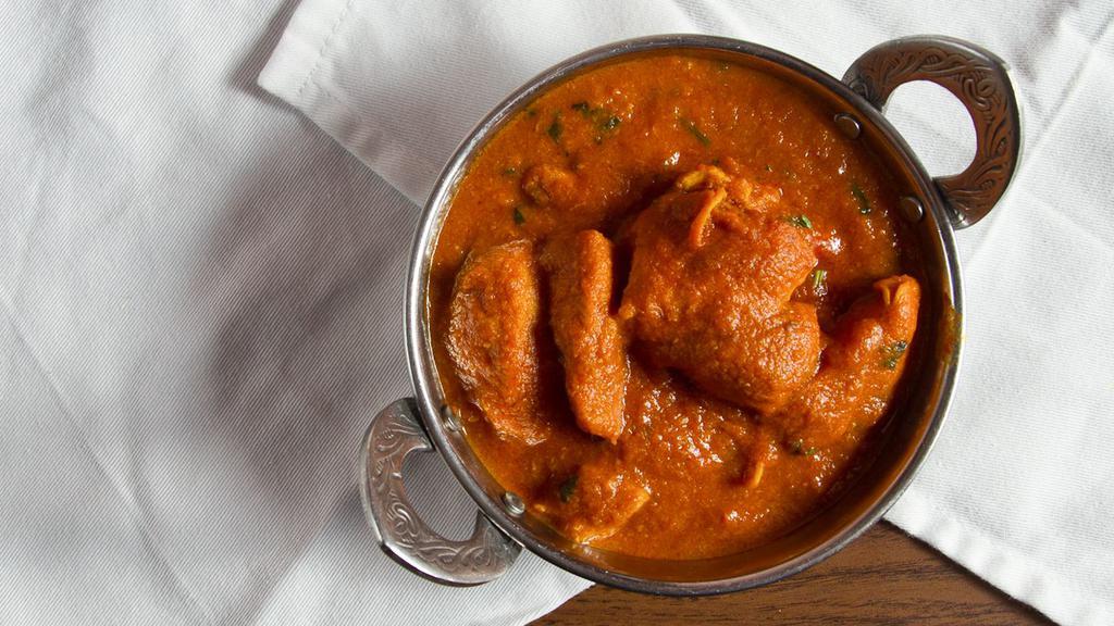 Chicken Curry · Skinless and boneless chicken cooked in a mildly spiced curry sauce.