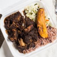 Oxtail And Beans · Dry rubbed in Jamaican seasoning, slow cooked for hours and simmered with white beans into a...