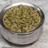 Palak Paneer · Vegetarian and gluten-free. Cottage cheese cube cooked with spiced spinach.