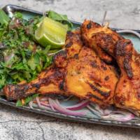 Traditional Tandoori Chicken · Gluten-free. Leg quarter marinating tenderizing mixture of hung yogurt & tandoori spices in ...