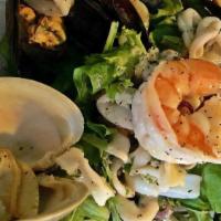 Frankies Italian Seafood Salad · Shrimp, mussels, clams, and calamari with virgin olive oil, garlic and lemon.