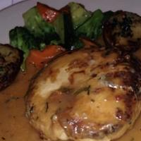 Chicken Rosemary · Stuffed with mozzarella cheese and prosciutto with a fresh rosemary wine sauce.